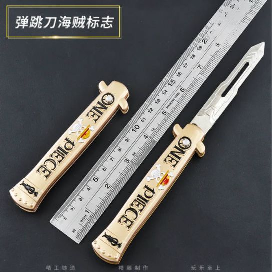 Нож выкидной с кнопкой тренировочный Ван Пис золотой